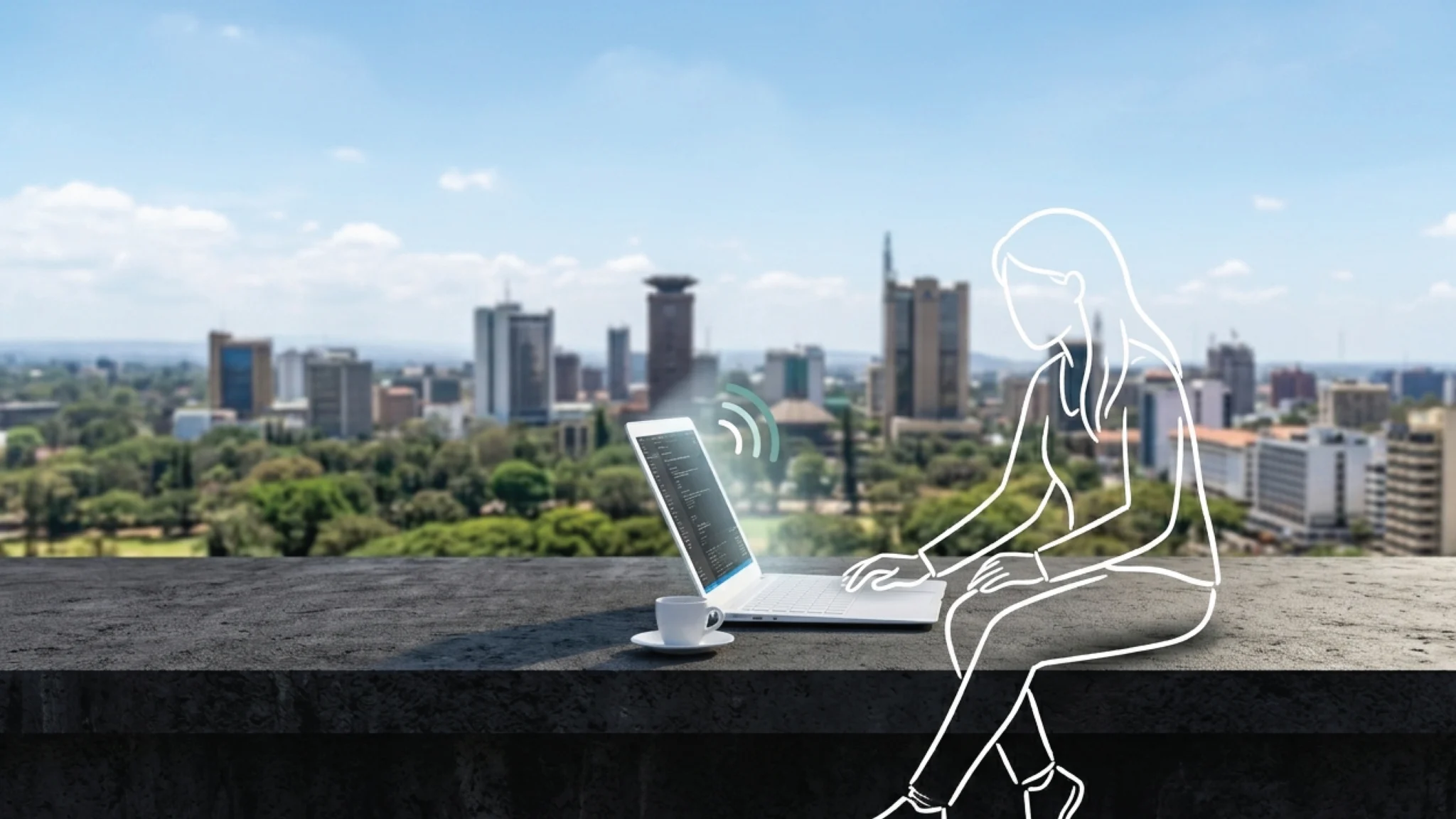 A slim open laptop on a dark concrete rooftop surface in Nairobi, the full city skyline stretching luminously behind it under a bright midday sky